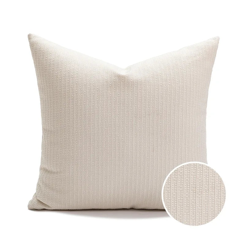 Beige textured pillow with a close-up of the fabric texture.