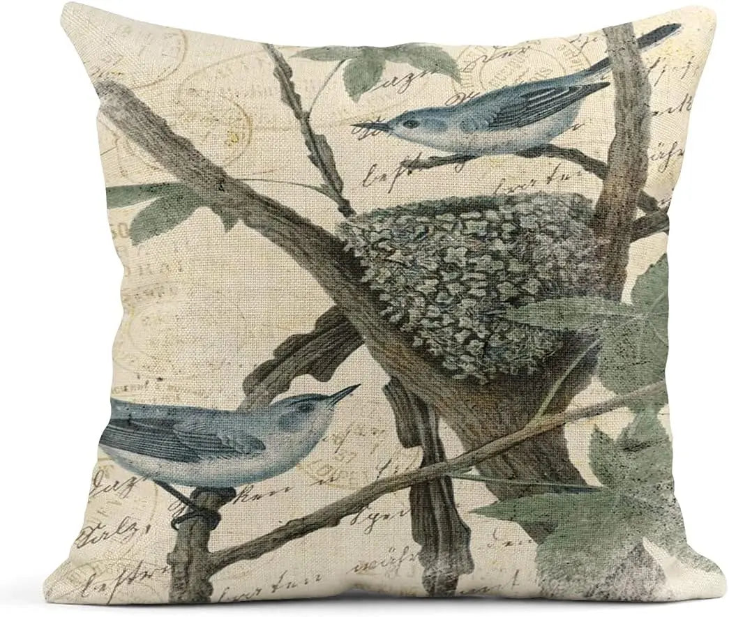 Decorative pillow with bird and nest design on a beige background