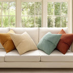 Neutral and green corduroy striped pillows styled in bright living room