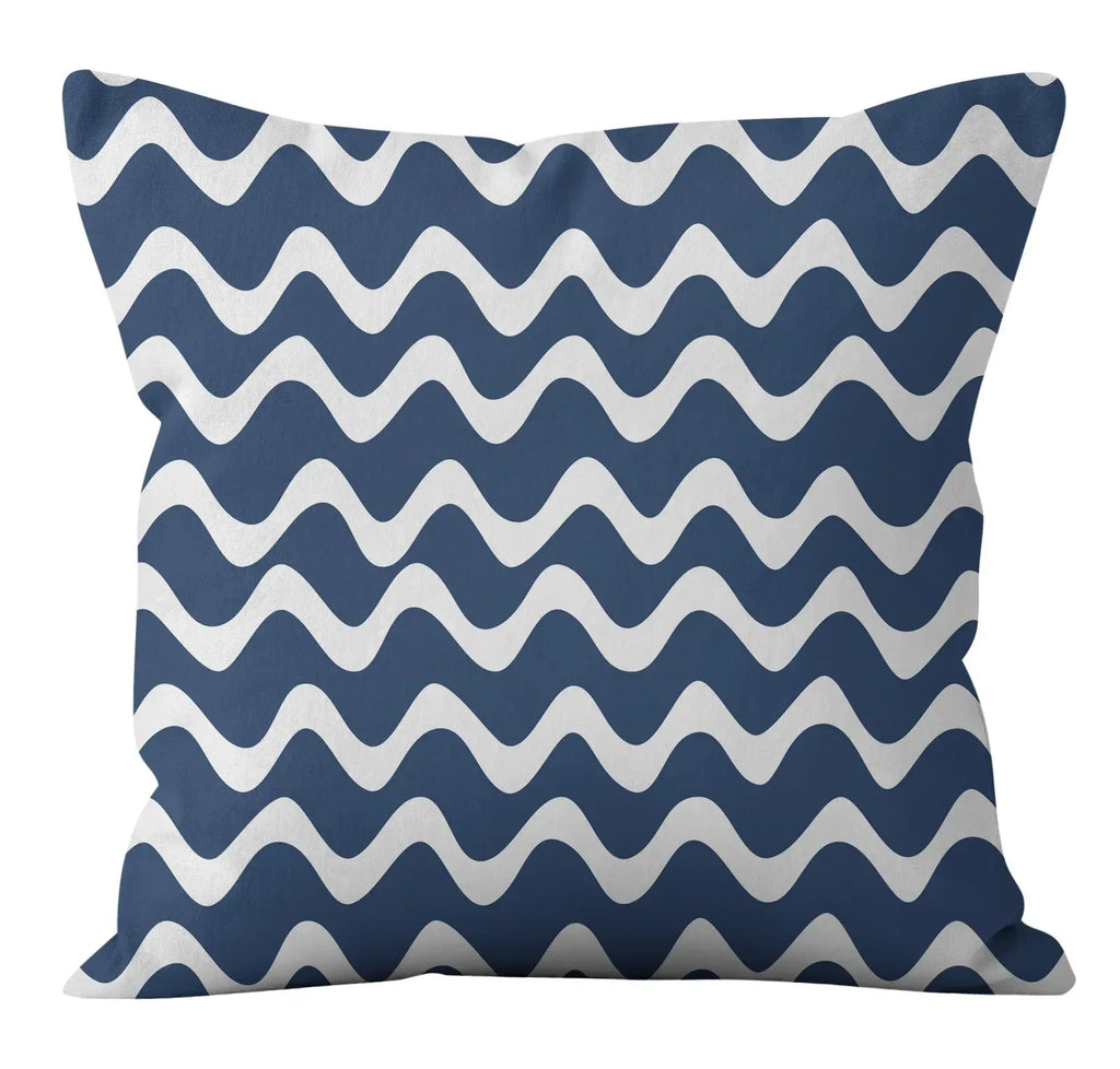 Navy blue pillow with white wavy pattern on a white background