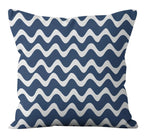 Navy blue pillow with white wavy pattern on a white background