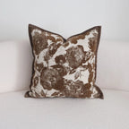 Floral patterned pillow on a white sofa
