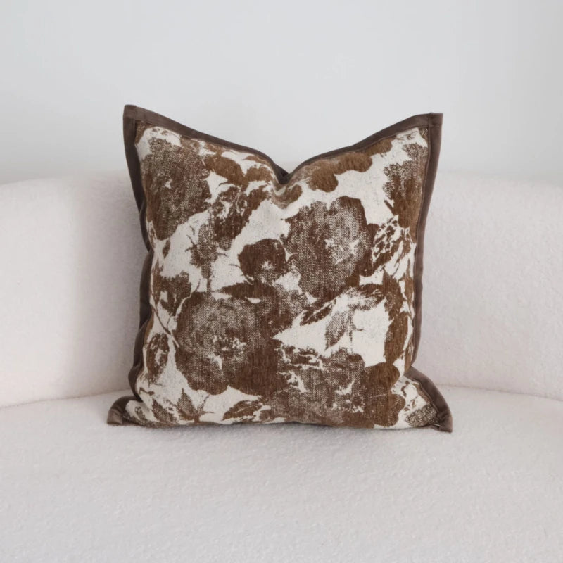 Floral patterned pillow on a white sofa