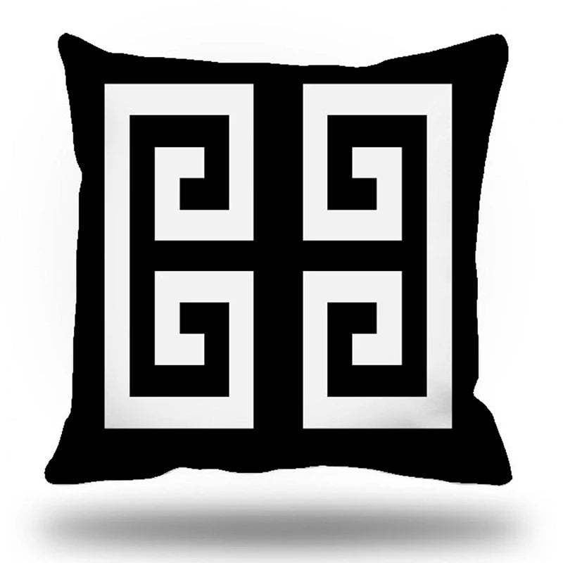 Decorative pillow with Greek key pattern on a black background
