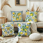 Decorative pillows with lemon pattern on a couch in a living room setting