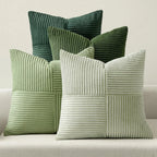 Green corduroy striped pillow covers in multiple shades on sofa