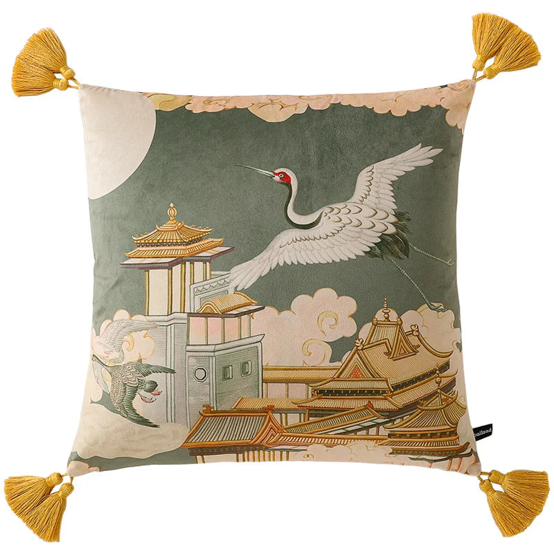 Decorative pillow with crane and traditional architecture design on a green background