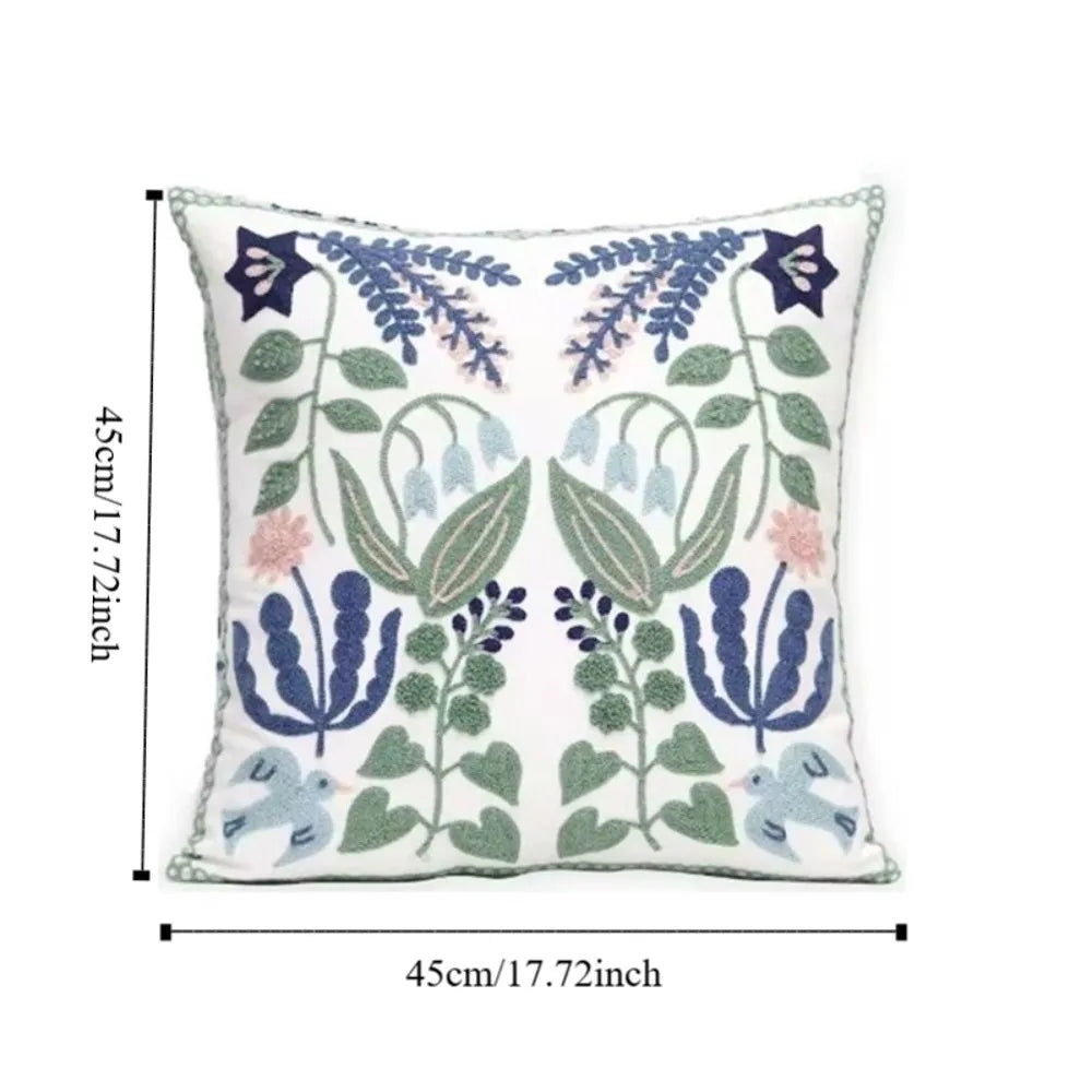 Decorative pillow with floral patterns and measurements on a white background