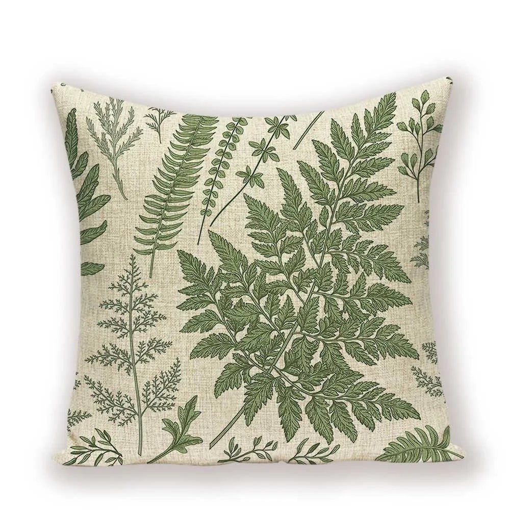 Pillow with green leaf pattern on a beige background