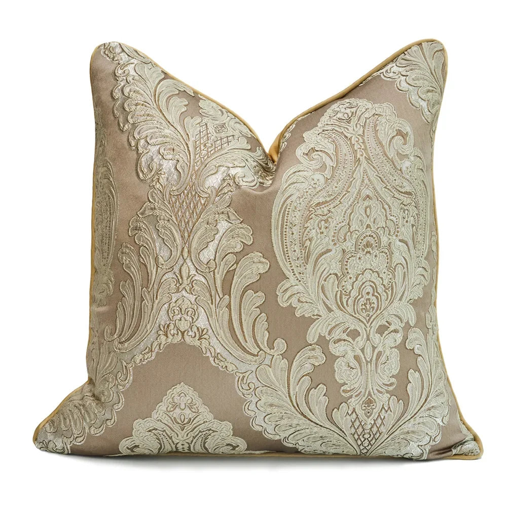 Decorative pillow with intricate beige and brown pattern on a white background