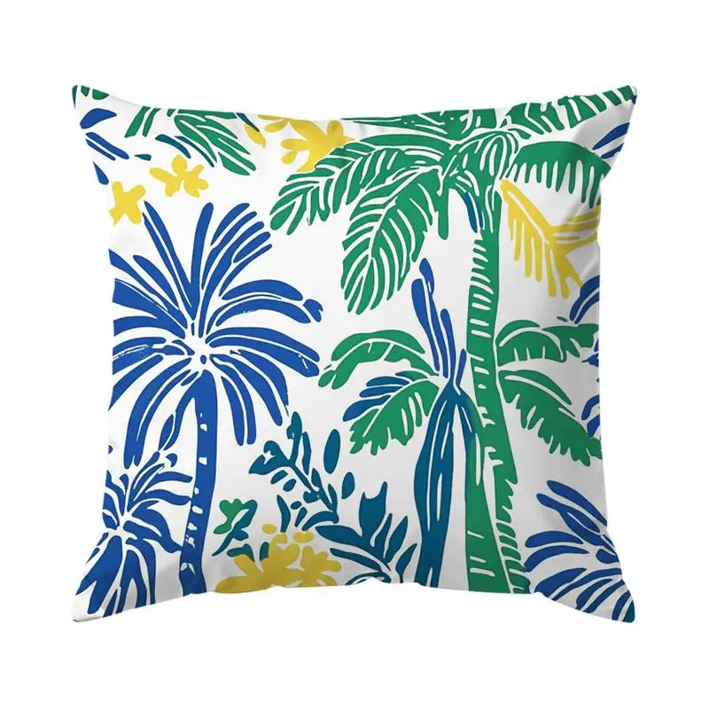 Decorative pillow with palm tree and leaf pattern on a white background