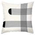 Decorative pillow with black geometric patterns