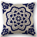 Decorative pillow with blue floral pattern on beige background