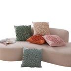Decorative plush velvet pillows with raised flower pattern in multiple colors