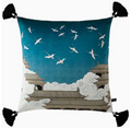 Decorative pillow with Japanese temple and crane design on a blue background