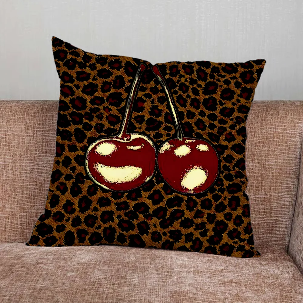 Leopard print pillow cover with cherry and star graphics in playful modern design