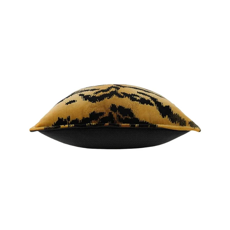Decorative pillow with black abstract pattern on a yellow background