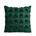 Green pillow with shamrock pattern on a white background