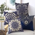 Decorative pillows with blue and white patterns on a sofa