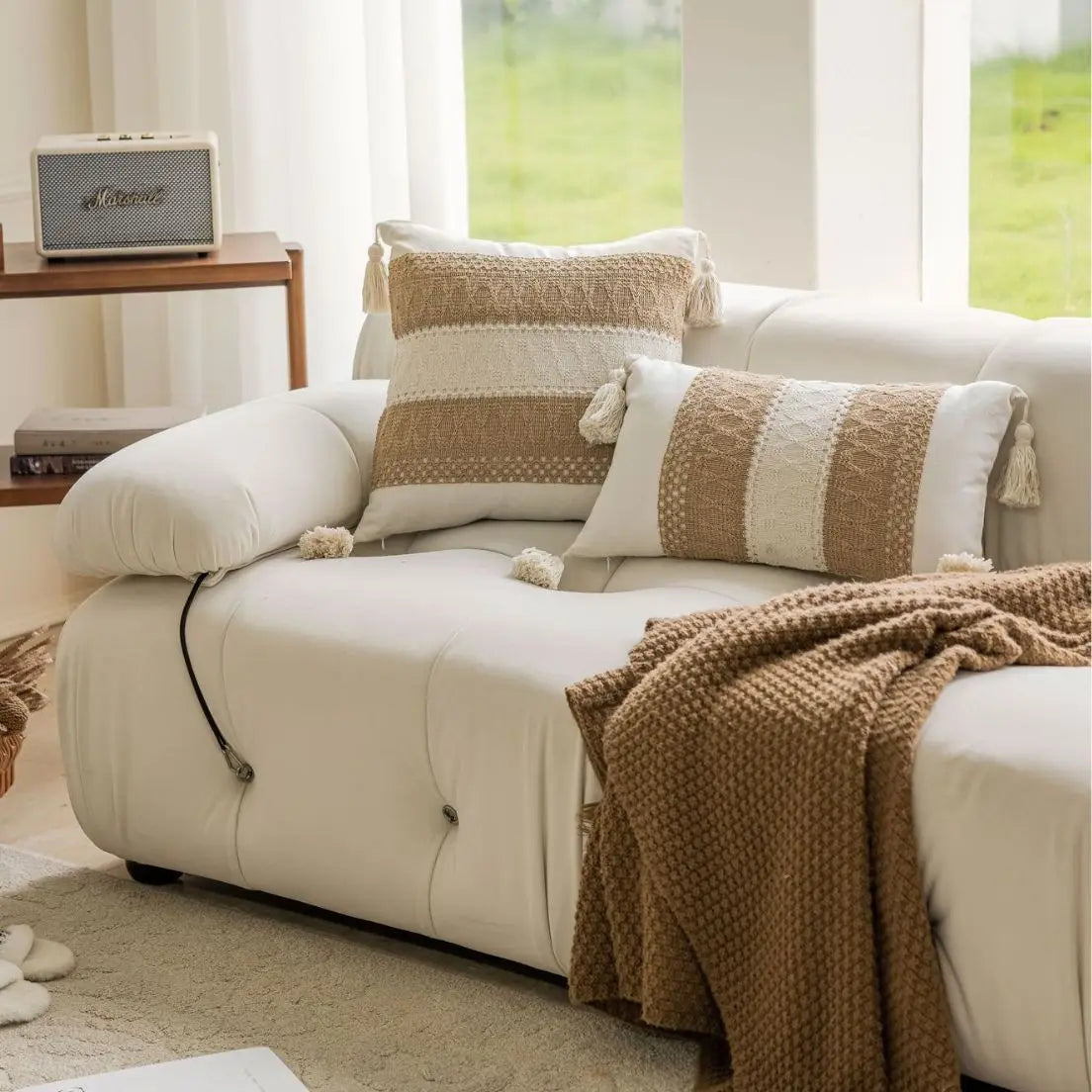 Neutral sofa with jacquard geometric pillows and cozy living room decor
