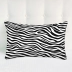 Black and white striped pillow on a white background