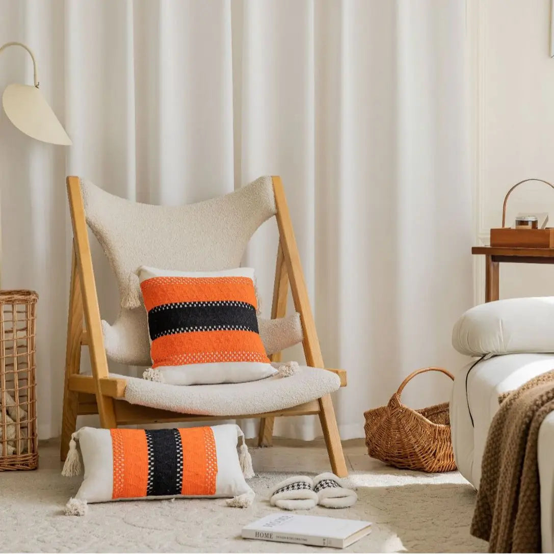 American jacquard cushion cover with orange and black geometric stripe pattern on chair
