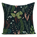 Decorative pillow with a botanical pattern on a dark background
