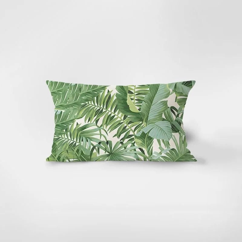 Pillow with green leaf pattern on a white background