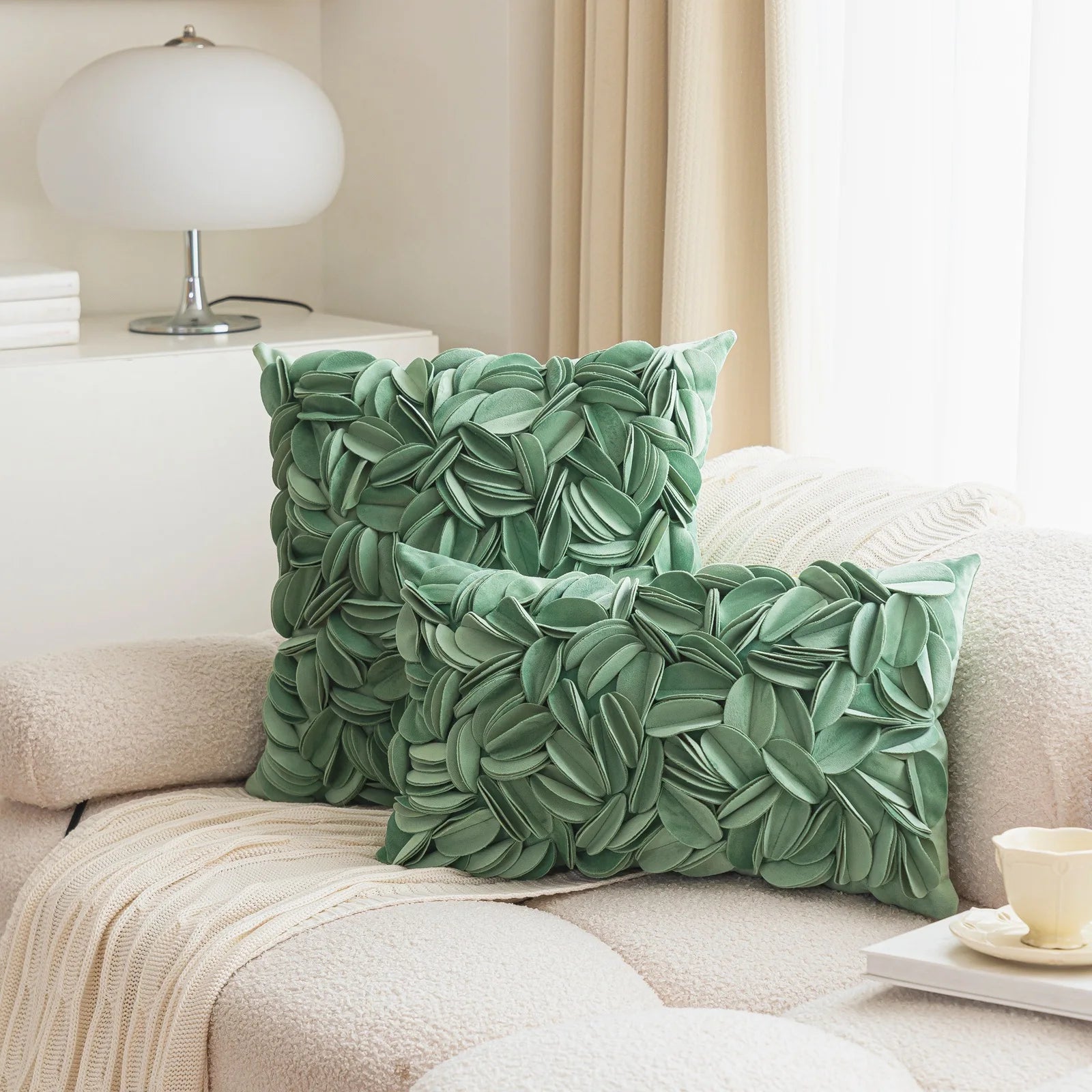 Green luxury velvet pillow cover with floral petal embroidery and elegant textured design