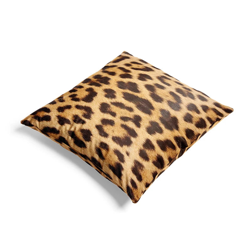 Leopard print pillow on a white background