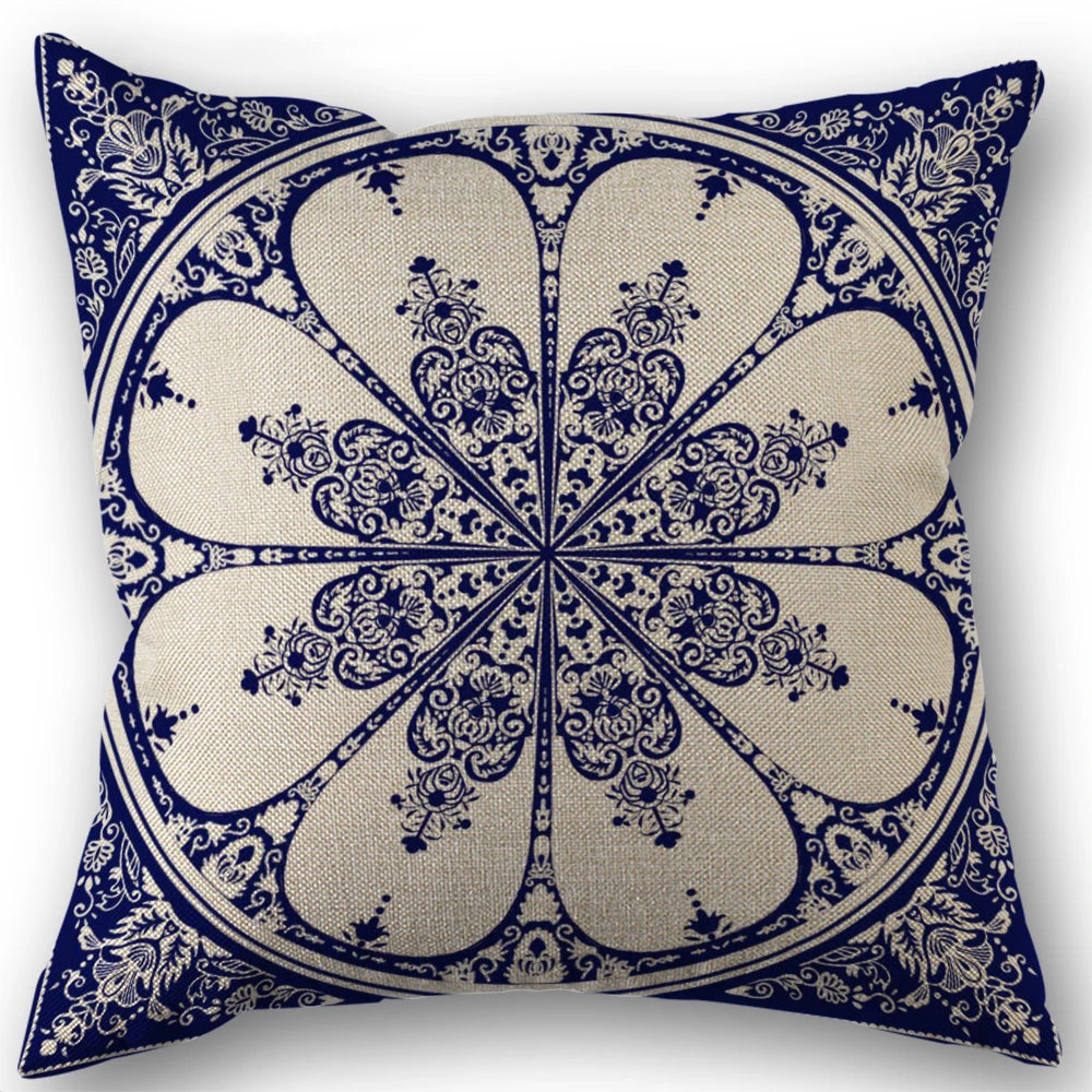 Decorative pillow with blue and white geometric pattern on a white background