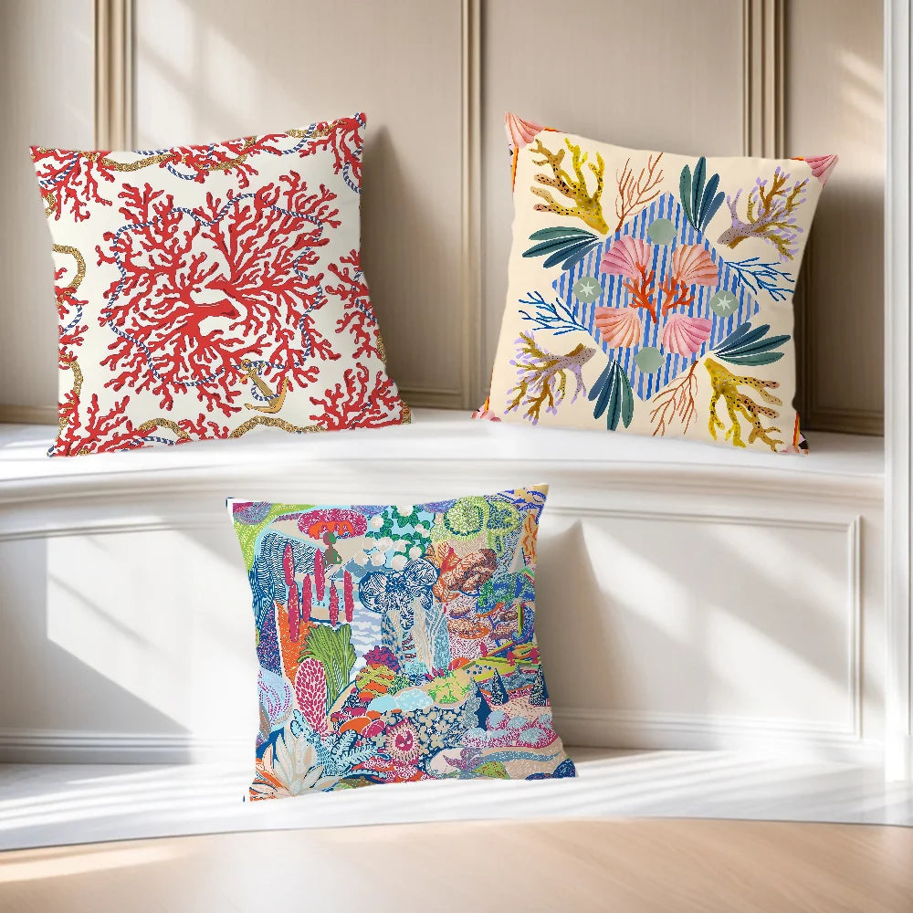 Decorative coastal pillow covers with vibrant coral reef and marine life prints
