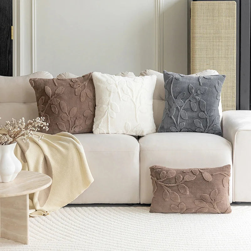 White sofa with decorative pillows in a living room setting