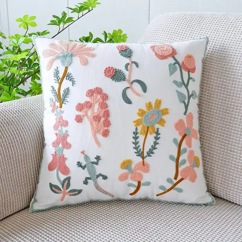 Decorative pillow with floral embroidery on a couch