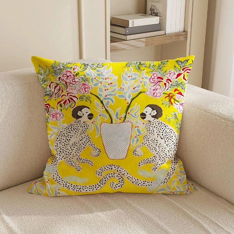 Decorative pillow with monkey design on a beige sofa