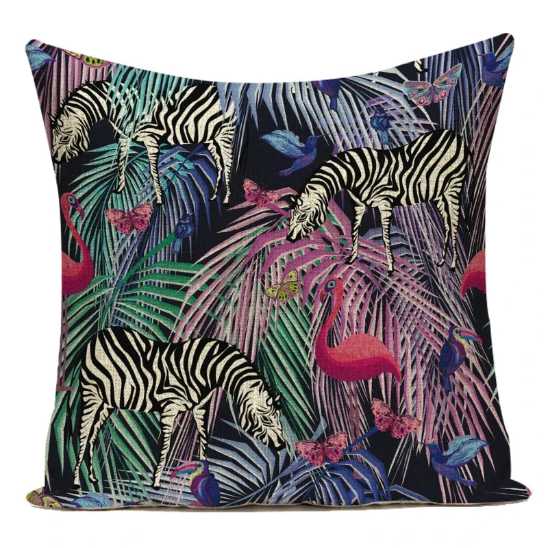 Decorative pillow with zebra and jungle leaf pattern on a white background