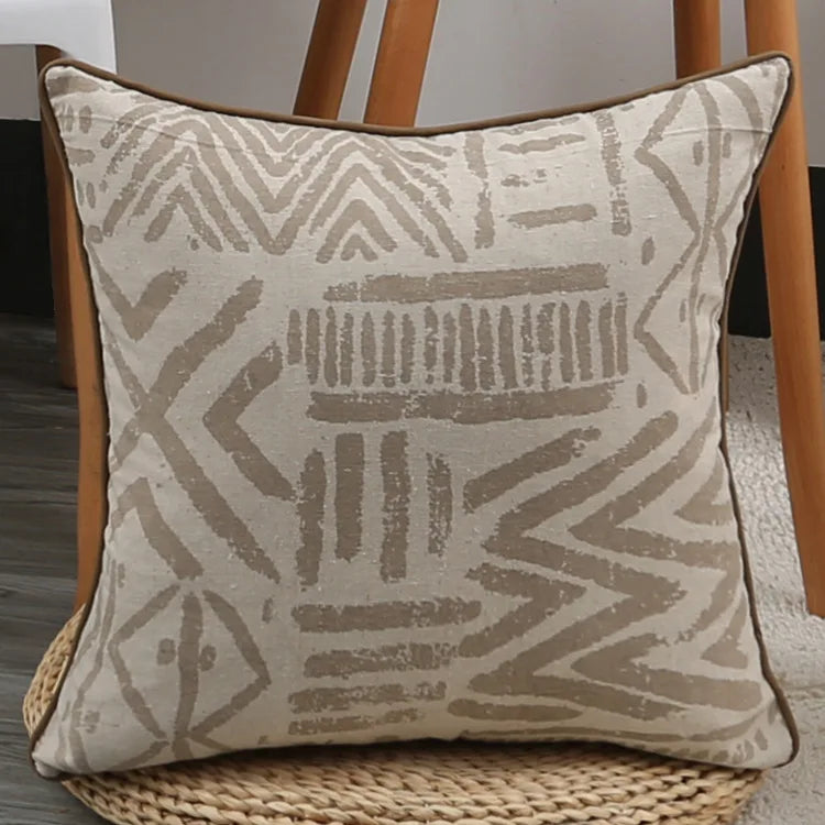 Decorative pillow with geometric pattern on a chair
