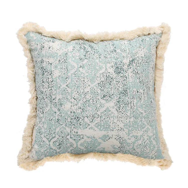Decorative pillow with textured pattern and beige trim on a white background
