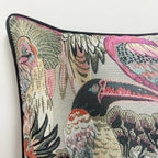 Decorative pillow with bird pattern on a plain background