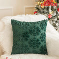 Green faux fur Christmas pillow cover with snowflake texture on festive sofa