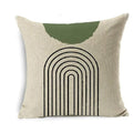 Decorative pillow with green arch and black lines on a beige background