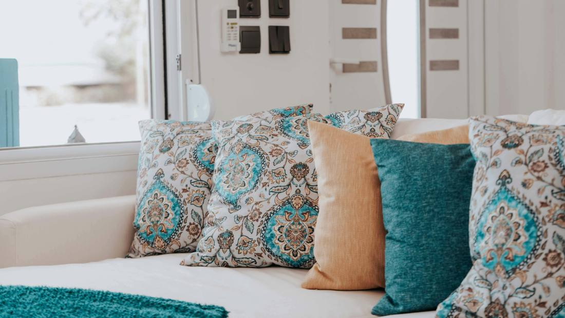 Patterned pillows styled on a sofa